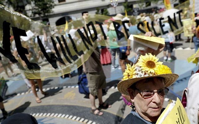 Environmental protesters arrive for a demonstration at Dillworth Park on Sunday, July 24, 2016, in Philadelphia. (AP Photo/John Minchillo)