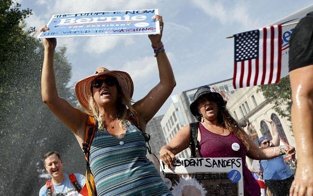 Supporters of Sen. Bernie Sanders, I-Vermont, march during a protest in downtown on Sunday, July 24, 2016, in Philadelphia. (AP Photo/John Minchillo) Supporters of Sen. Bernie Sanders, I-Vermont, march during a protest in downtown on Sunday, July 24, 2016, in Philadelphia. (AP Photo/John Minchillo)