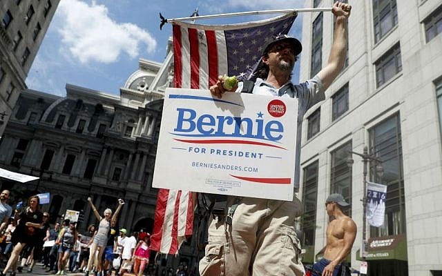 Supporters of Sen. Bernie Sanders, I-Vermont, march during a protest in downtown on Sunday, July 24, 2016, in Philadelphia. (AP Photo/John Minchillo) Supporters of Sen. Bernie Sanders, I-Vermont, march during a protest in downtown on Sunday, July 24, 2016, in Philadelphia. (AP Photo/John Minchillo)