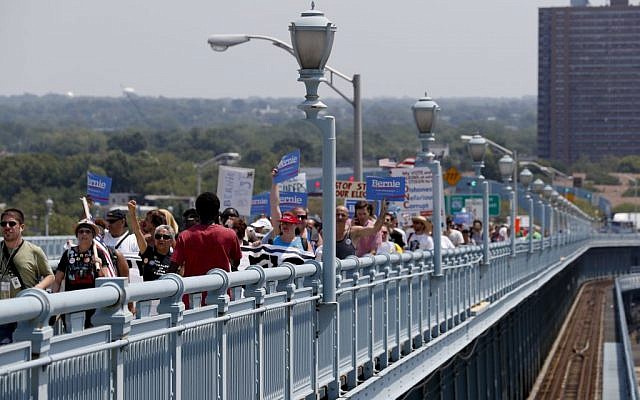 Demonstrators make their way to downtown Philadelphia on the Benjamin Franklin Bridge near Camden, N.J. on Monday, July 25, 2016, during the first day of the Democratic National Convention. (AP/Alex Brandon)