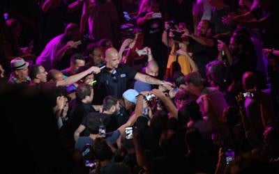 Buddy Guy entered the crowd during his song 'Slippin in on You' and was immediately surrounded by camera-wielding fans. (Miriam Nahum/Times of Israel)