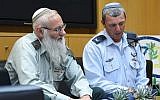 Rabbi Col. Eyal Karim (left), nominated to become IDF chief rabbi, sits next to his predecessor, Brig. Gen. Rafi Peretz, on April 21, 2016 (Diana Khananashvili/Defense Ministry)