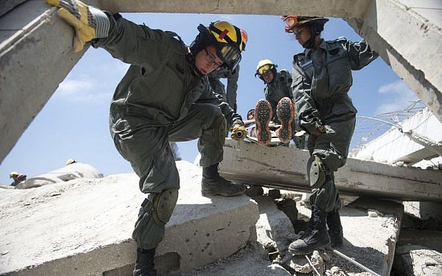 Soldiers in the IDF Home Front Command's search and rescue units carry a stretcher during a large-scale exercise in Zikim near the Gaza border on July 3, 2016. (IDF Spokesperson's Unit) Soldiers in the IDF Home Front Command's search and rescue units carry a stretcher during a large-scale exercise in Zikim near the Gaza border on July 3, 2016. (IDF Spokesperson's Unit)