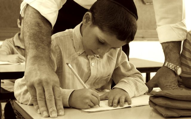 Illustrative photo: Israeli orthodox child studying in his classroom (Abir Sultan/Flash 90)