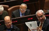 Prime Minister Benjamin Netanyahu reads a newspaper in the Knesset. Jan 06, 2010. (Kobi Gideon/ FLASH90)