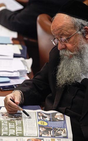 United Torah Judaism MK Menachem Eliezer Moses reads a newspaper at the Knesset plenum in Jerusalem, July 31, 2013. (Flash90) United Torah Judaism MK Menachem Eliezer Moses reads a newspaper at the Knesset plenum in Jerusalem, July 31, 2013. (Flash90)