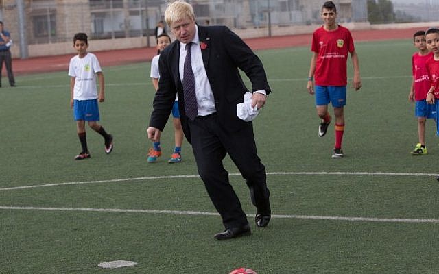 Boris Johnson kicks the ball during a ceremony and a soccer match with the 'Equaliser' football project, a mixed soccer team of Arab and Jewish youth in Jerusalem on November 10, 2015. (Yonatan Sindel/Flash90) Boris Johnson kicks the ball during a ceremony and a soccer match with the 'Equaliser' football project, a mixed soccer team of Arab and Jewish youth in Jerusalem on November 10, 2015. (Yonatan Sindel/Flash90)