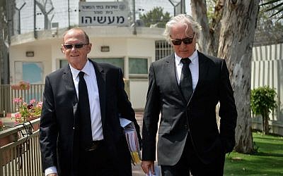 Zion Amir and Yehoshua Reznik, attorneys of former Israeli president Moshe Katsav, leave a hearing at the Israel Prison Service, where the parole board denied Katsav's request to deduct one third of the seven year prison sentence imposed on him, April 06, 2016. (FLASH90)