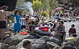 Israelis try to enjoy the crowded beaches of the Sea of Galilee during the Passover holiday on April 26, 2016. (Hadas Parush/Flash90)