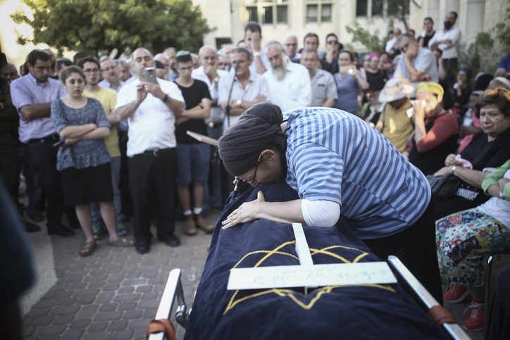 Rina Ariel mourns over the body of her 13-year-old daughter Hallel Yaffa, who was stabbed to death by a Palestinian terrorist in her home, during her eulogy in the Kiryat Arba settlement on June 30, 2016. (Yonatan Sindel/Flash90) Rina Ariel mourns over the body of her 13-year-old daughter Hallel Yaffa, who was stabbed to death by a Palestinian terrorist in her home, during her eulogy in the Kiryat Arba settlement on June 30, 2016. (Yonatan Sindel/Flash90)