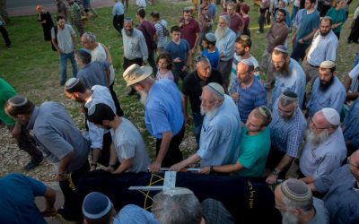 Friends and family members of Hallel Yaffa Ariel carry her body during her funeral procession in the Jewish settlement of Kiryat Arba, in the West Bank, on June 30, 2016. (Yonatan Sindel/Flash90)