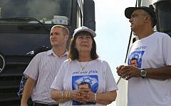 Parents of fallen IDF soldier Oron Shaul and friends block trucks heading to the Gaza Strip at the Erez Crossing in southern Israel, on July 3, 2016, after the cabinet voted to approve the reconciliation agreement with Turkey. (Flash90)
