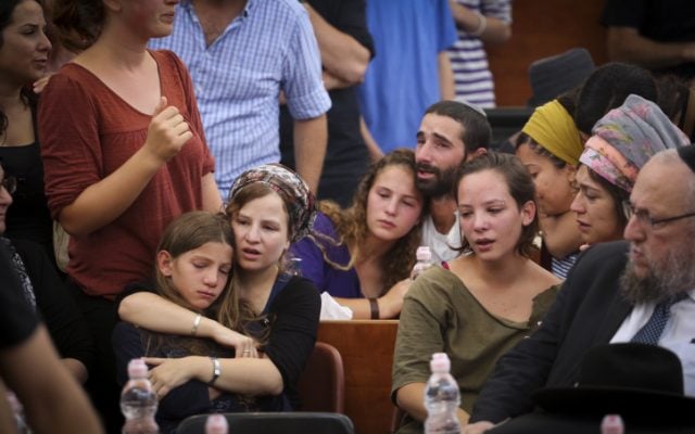 The children of Rabbi Miki Mark mourn at a service prior to his funeral at the Otniel yeshiva, where Rabbi Mark was director, on July 3, 2016. (Hadas Parush/FLASH90) The children of Rabbi Miki Mark mourn at a service prior to his funeral at the Otniel yeshiva, where Rabbi Mark was director, on July 3, 2016. (Hadas Parush/FLASH90)