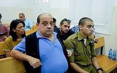 Elior Azaria, an Israeli soldier on trial for manslaughter, with his father Charlie, at a military court in Jaffa, July 06, 2016. (Flash90)
