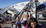 Illustrative: New immigrants from North America land at Israel's Ben Gurion airport after a Nefesh B'Nefesh chartered flight from New York, July 19, 2016. (Yossi Zamir/Flash90)