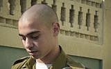 Sgt. Elor Azaria, the IDF soldier who shot an incapacitated Palestinian terrorist in Hebron, seen outside the military court in Jaffa, July 24, 2016. (Flash90)