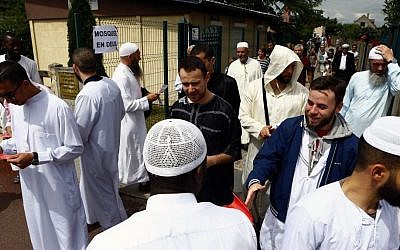Muslim worshippers walk out after the friday prayer at the Yahya Mosque, in Saint-Etienne-du-Rouvray, Normandy, France, Friday, July 29, 2016 (AP Photo/Francois Mori)