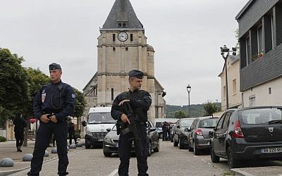 French riot police guards the street to access the church where an hostage taking left a priest dead in Saint-Etienne-du-Rouvray, Normandy, France, Tuesday, July 26, 2016. (AP Photo/Francois Mori) French riot police guards the street to access the church where an hostage taking left a priest dead in Saint-Etienne-du-Rouvray, Normandy, France, Tuesday, July 26, 2016. (AP Photo/Francois Mori)