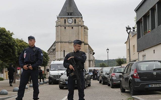 French riot police guards the street to access the church where an hostage taking left a priest dead in Saint-Etienne-du-Rouvray, Normandy, France, Tuesday, July 26, 2016. (AP Photo/Francois Mori) French riot police guards the street to access the church where an hostage taking left a priest dead in Saint-Etienne-du-Rouvray, Normandy, France, Tuesday, July 26, 2016. (AP Photo/Francois Mori)