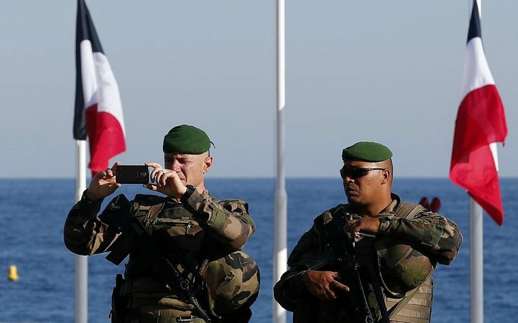 French soldiers patrol on the famed Promenade des Anglais in Nice, southern France, three days after a truck mowed through revelers, Sunday, July 17, 2016. (AP Photo/Francois Mori)