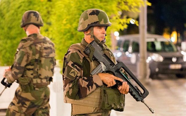French soldiers stand guard by the sealed off area of a terror attack after a truck drove onto the sidewalk and plowed through a crowd of revelers who'd gathered to watch the fireworks in the French resort city of Nice, southern France, Friday, July 15, 2016. (AP Photo/Ciaran Fahey) French soldiers stand guard by the sealed off area of a terror attack after a truck drove onto the sidewalk and plowed through a crowd of revelers who'd gathered to watch the fireworks in the French resort city of Nice, southern France, Friday, July 15, 2016. (AP Photo/Ciaran Fahey)