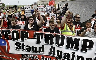 Protesters yell during a rally against Republican presidential candidate Donald Trump on Monday, July 18, 2016, in Cleveland, Ohio. (AP Photo/Patrick Semansky)
