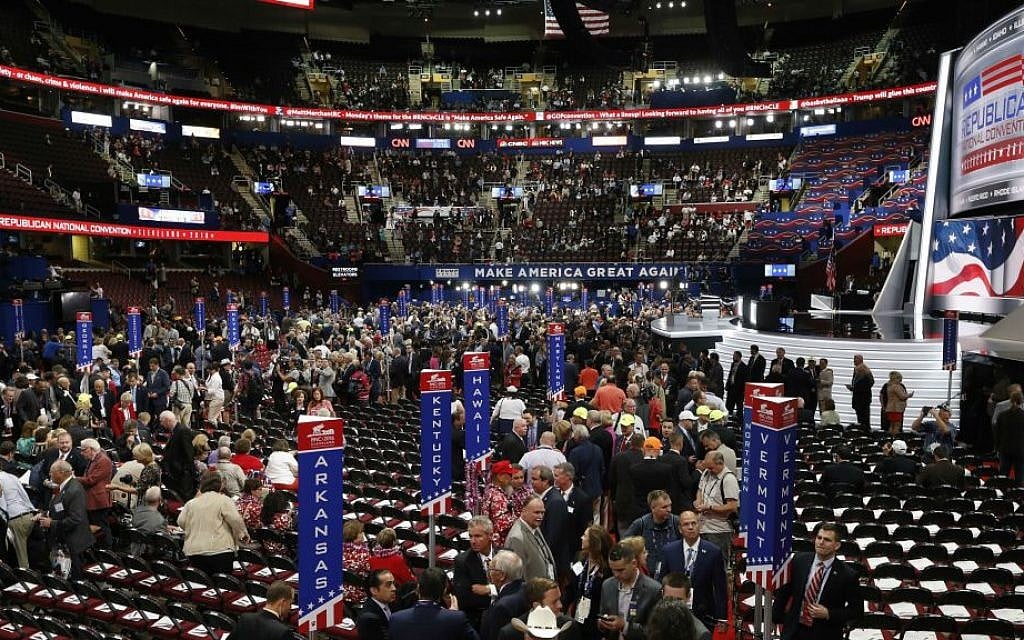 Delegates arrive at the Quicken Loans Arena before the start of the Republican National Convention in Cleveland, Ohio, Monday, July 18, 2016. (AP Photo/Paul Sancya)