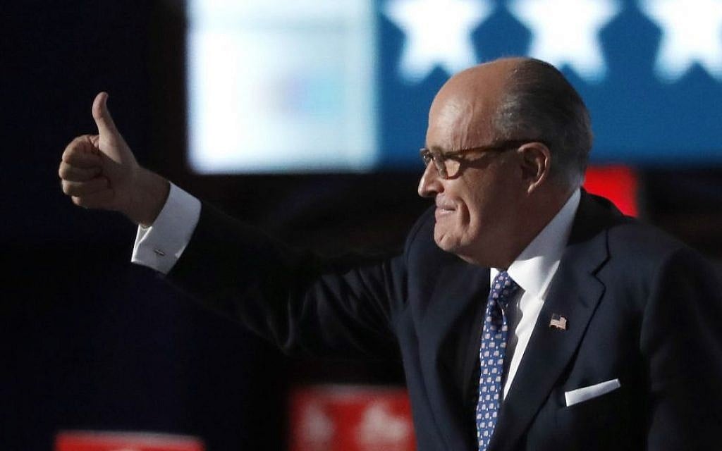 Former New York mayor Rudy Giuliani gives a thumbs up as he walks to the podium to address delegates during the opening day of the Republican National Convention in Cleveland, Ohio, Monday, July 18, 2016. (AP Photo/Paul Sancya)