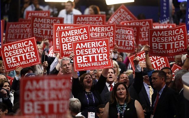 Delegates hold signs as Gov. Scott Walker of Wisconsin speaks during the third day of the Republican National Convention in Cleveland, Wednesday, July 20, 2016. (AP Photo/Paul Sancya) Delegates hold signs as Gov. Scott Walker of Wisconsin speaks during the third day of the Republican National Convention in Cleveland, Wednesday, July 20, 2016. (AP Photo/Paul Sancya)