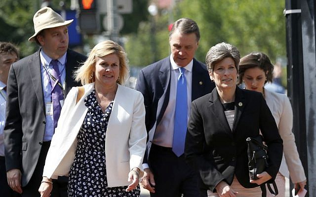 Sen. David Perdue, R-Georgia, center, Sen. Joni Ernst, R-Iowa, second from right, and others, arrive for a meeting with Republican presidential candidate Donald Trump and the Senate Republican Conference, Thursday, July 7, 2016, at the National Republican Senatorial Committee headquarters in Washington. (AP Photo/Alex Brandon)