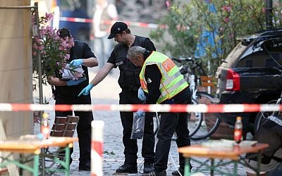 German police investigate at the site in Ansbach, Germany, Monday, July 25, 2016, where a failed asylum-seeker from Syria blew himself up. (Daniel Karmann/dpa via AP) German police investigate at the site in Ansbach, Germany, Monday, July 25, 2016, where a failed asylum-seeker from Syria blew himself up. (Daniel Karmann/dpa via AP)