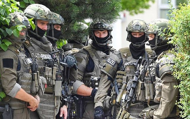 Members of a special forces stand near a fast food restaurant where a shooting took place leaving nine people dead the day before on Saturday, July 23, 2016 in Munich, Germany. (AP/Kerstin Joensson) Members of a special forces stand near a fast food restaurant where a shooting took place leaving nine people dead the day before on Saturday, July 23, 2016 in Munich, Germany. (AP/Kerstin Joensson)