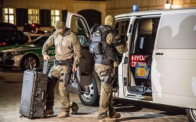 Special police officers arrive at the scene after an explosion occurred in Ansbach, Germany, Monday, July 25, 2016. (Friebe/dpa via AP)