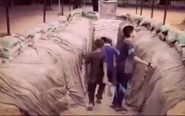 An image taken from a video on Hamas's Facebook page on July 20, 2016, shows Palestinian children entering into a tunnel dug by the terror group in the Gaza Strip. (Screen capture from Facebook) An image taken from a video on Hamas's Facebook page on July 20, 2016, shows Palestinian children entering into a tunnel dug by the terror group in the Gaza Strip. (Screen capture from Facebook)