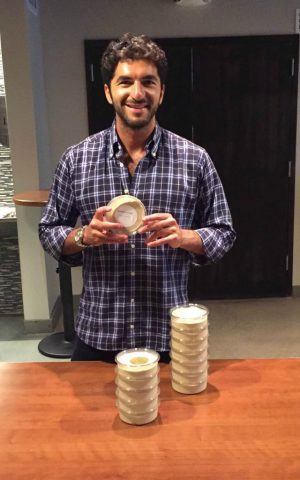 Ohad Fisherman with containers of his Hummus Joonam, which has become a favorite among the New York elite. (Courtesy)