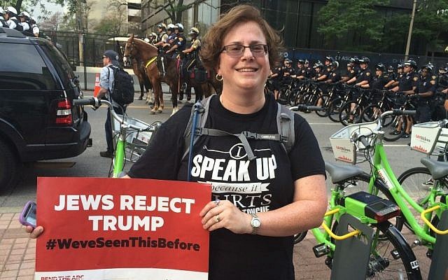 Naomi Zikmund-Fisher protests Donald Trump outside the 2016 Republican National Convention with a sign that reads 'Jews Reject Trump' (Eric Cortellessa/Times of Israel)