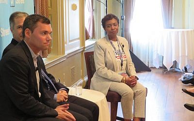 Rep. Yvette Clarke, D-N.Y., speaks Tuesday, July 26 at a J Street panel held near the Democratic National Convention in Philadelphia. At left is journalist Peter Beinart, and behind him pollster Jim Gerstein. (JTA)