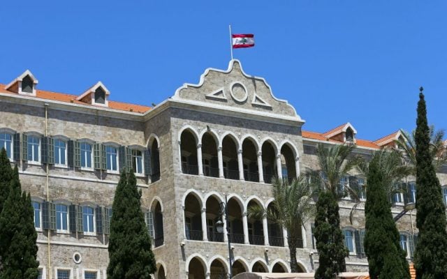 The Lebanese flag flies at half staff atop Government House in Beirut to pay respect to victims of Monday's terror attacks in the eastern Lebanese village of Qaa, in downtown Beirut, Tuesday, June 28, 2016. (AP Photo/Hassan Ammar)