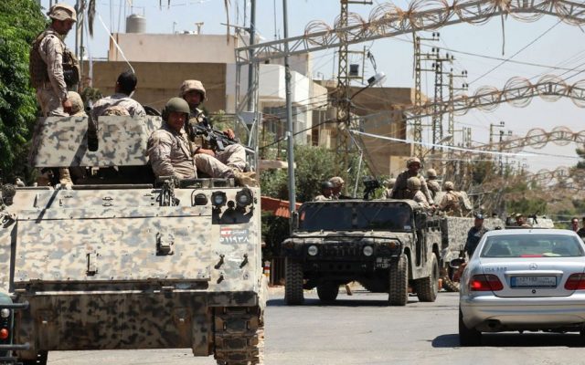 Lebanese army soldiers from the special forces unit patrol Qaa, a predominantly Lebanese Christian village near the Syrian border where suicide bombers blew themselves up among civilians the day before, Tuesday, June 28, 2016. (AP)
