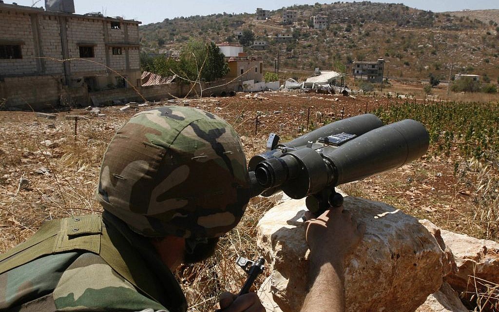 In this Wednesday, Aug. 16, 2006 file photo, a Hezbollah fighter, who refused to be identified, uses binoculars to scan for Israeli forces' positions, in the outskirts of the southern village of Aitaroun, close to the town of Bint Jbeil. (AP Photo / Mohammed Zaatari, File) In this Wednesday, Aug. 16, 2006 file photo, a Hezbollah fighter, who refused to be identified, uses binoculars to scan for Israeli forces' positions, in the outskirts of the southern village of Aitaroun, close to the town of Bint Jbeil. (AP Photo / Mohammed Zaatari, File)