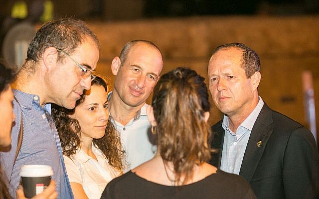 Nir Barkat, right, speaking to the parents of Shira Banki at a memorial event in Jerusalem on July 19, 2016. (Noam Feiner/Yerushalmim) Nir Barkat, right, speaking to the parents of Shira Banki at a memorial event in Jerusalem on July 19, 2016. (Noam Feiner/Yerushalmim)