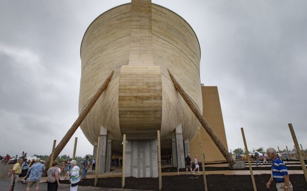 Visitors roam around a replica Noah's Ark as rain clouds pass overhead at the Ark Encounter theme park during a media preview day on July 5, 2016, in Williamstown, Ky. (AP Photo/John Minchillo)