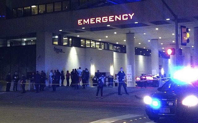 Police and others gather at the emergency entrance to Baylor Medical Center in Dallas, Texas, where several police officers were taken after the shootings on July 7, 2016. (AP/Emily Schmall)