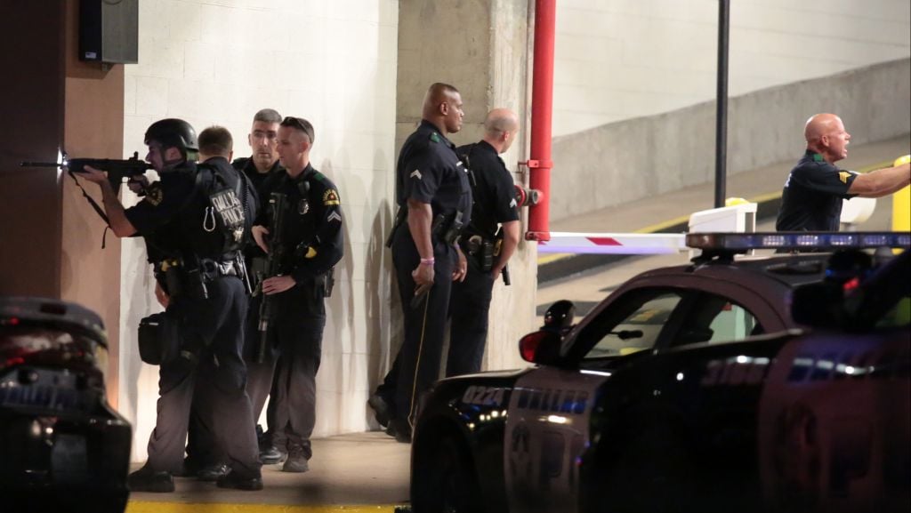 Dallas police respond after shots were fired during a protest over recent fatal shootings by police in Louisiana and Minnesota, Thursday, July 7, 2016, in Dallas. Snipers opened fire on police officers during protests; several officers were killed, police said. (Maria R. Olivas/The Dallas Morning News via AP) Dallas police respond after shots were fired during a protest over recent fatal shootings by police in Louisiana and Minnesota, Thursday, July 7, 2016, in Dallas. Snipers opened fire on police officers during protests; several officers were killed, police said. (Maria R. Olivas/The Dallas Morning News via AP)
