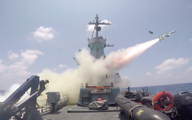 An Israel Navy ship fires a Harpoon sea-to-sea missile at a decommissioned boat during an exercise on July 5, 2016. (Screen capture: IDF Spokesperson's Unit)