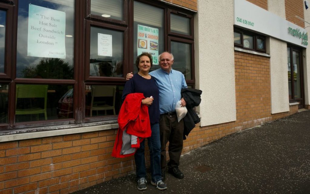 Howard and Claire Singerman standing outside Mark's Deli, a Jewish restaurant in Glasgow, July 4, 2016. (Cnaan Liphshiz/via JTA) Howard and Claire Singerman standing outside Mark's Deli, a Jewish restaurant in Glasgow, July 4, 2016. (Cnaan Liphshiz/via JTA)