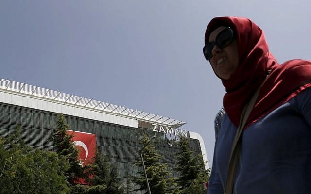 A woman walks past the headquarters of 'Zaman' newspaper, after being closed by the government in Istanbul, Thursday, July 28, 2016. (AP Photo/Petros Karadjias) A woman walks past the headquarters of 'Zaman' newspaper, after being closed by the government in Istanbul, Thursday, July 28, 2016. (AP Photo/Petros Karadjias)