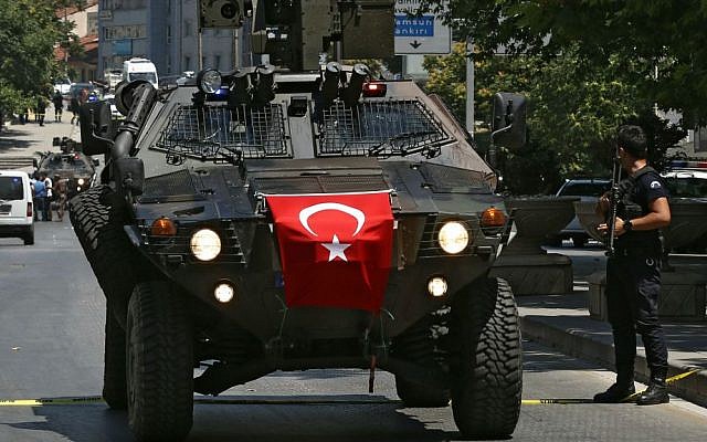 A Turkish police special forces APC arrives at the scene where the Ankara governor's office says a military officer was detained after he shot and killed the driver of a vehicle he had hijacked, at Ulus district in Ankara, Turkey, Monday, July 18, 2016. (AP Photo/Hussein Malla)