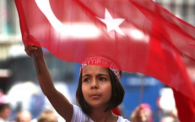 A Turkish girl wearing a headband bearing the name of Turkish president Recep Tayyip Erdogan during a pro-government demonstration in front of the old parliament building, in Ankara, Turkey, July 20, 2016. (AP Photo/Hussein Malla) A Turkish girl wearing a headband bearing the name of Turkish president Recep Tayyip Erdogan during a pro-government demonstration in front of the old parliament building, in Ankara, Turkey, July 20, 2016. (AP Photo/Hussein Malla)