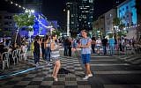 Israelis socialize during Tel Aviv's annual White Night celebration, June 30, 2016. (Miriam Alster/Flash90)